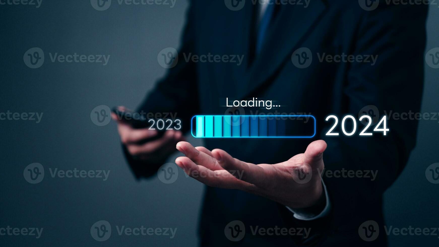 loading progress bar to 2024 Businessman using mobile phone investment and planning marketing finance and target growth success photo