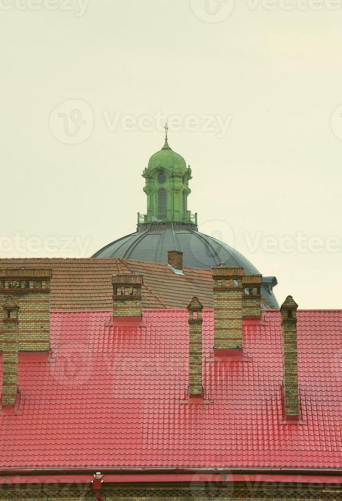 Fragment of a metal roof of the restored old multi-storey building in Lviv, Ukraine photo