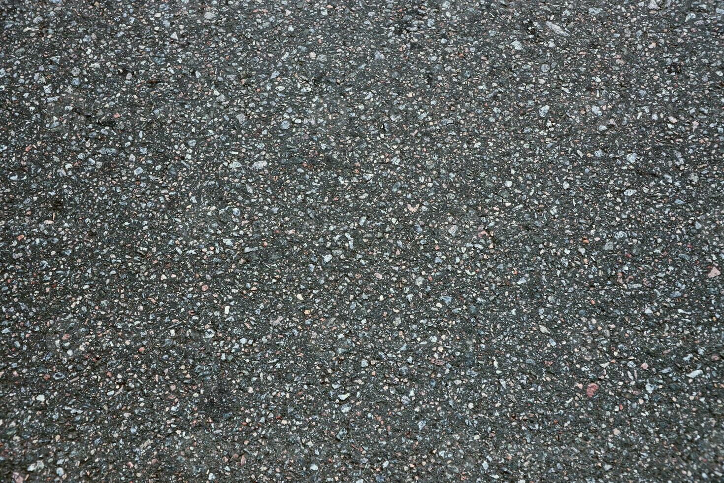 Surface grunge rough of asphalt. Tarmac dark grey grainy road. Texture Background Top view photo