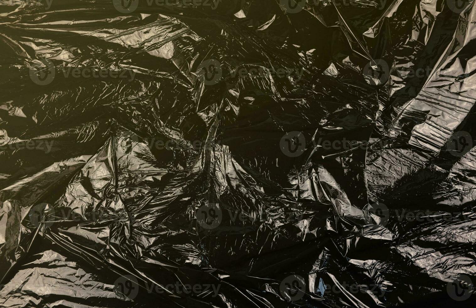Texture of black plastic garbage disposable bag photo