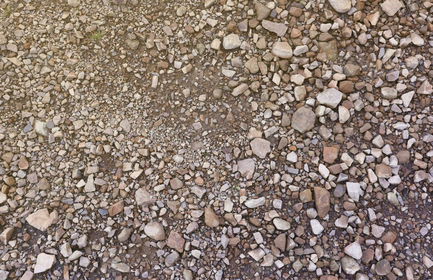 Background of shattered stony stones surface in mountain area. Texture with natural light photo