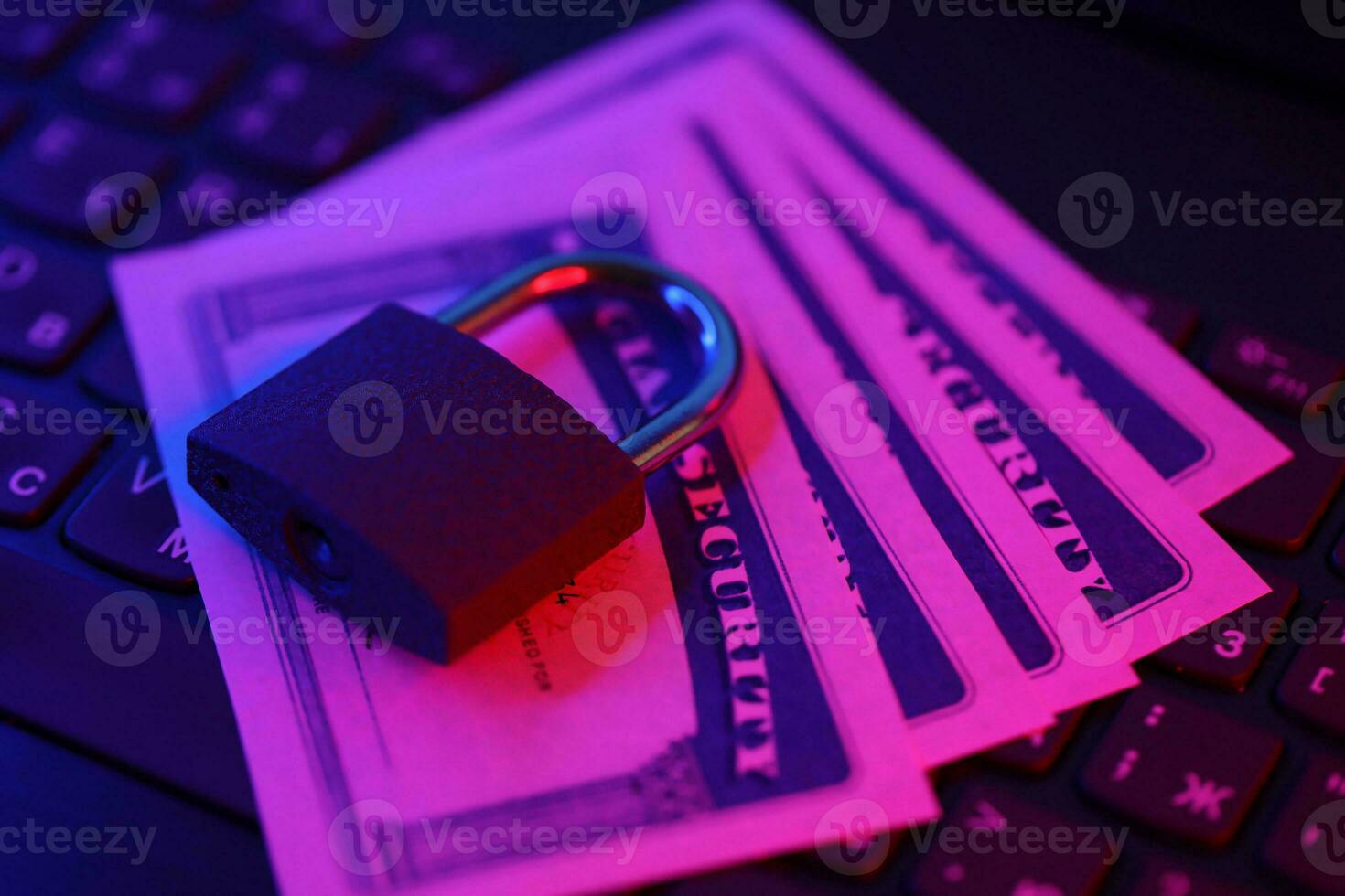 Padlock and social security card on computer keyboard. Identity theft and identity protection concept photo