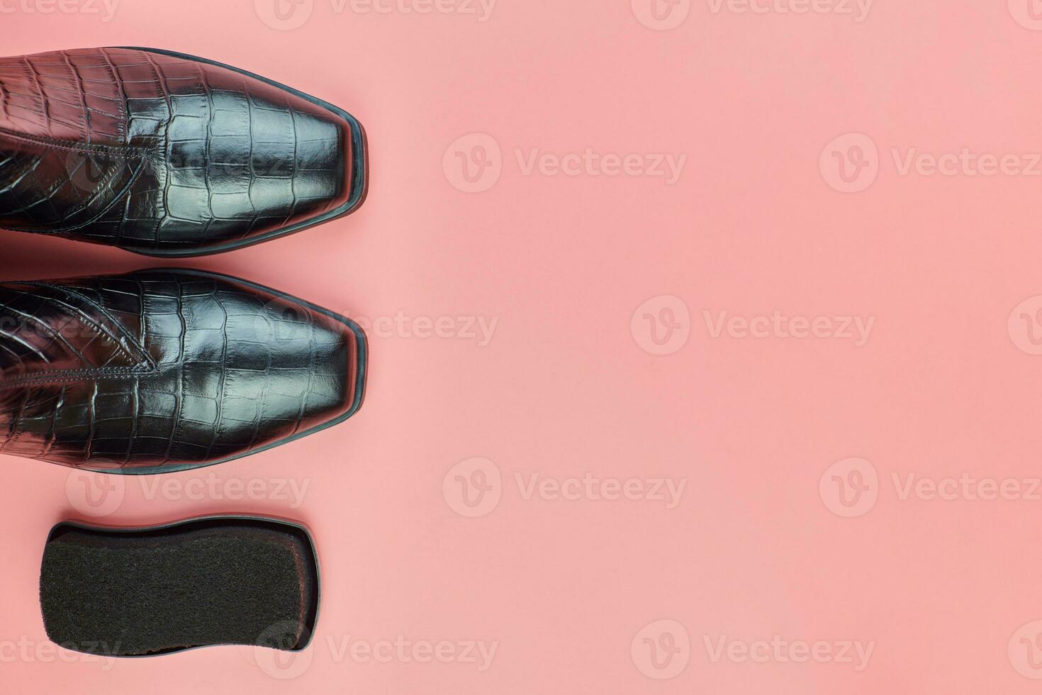 Woman shoes with polish sponge, copy space photo