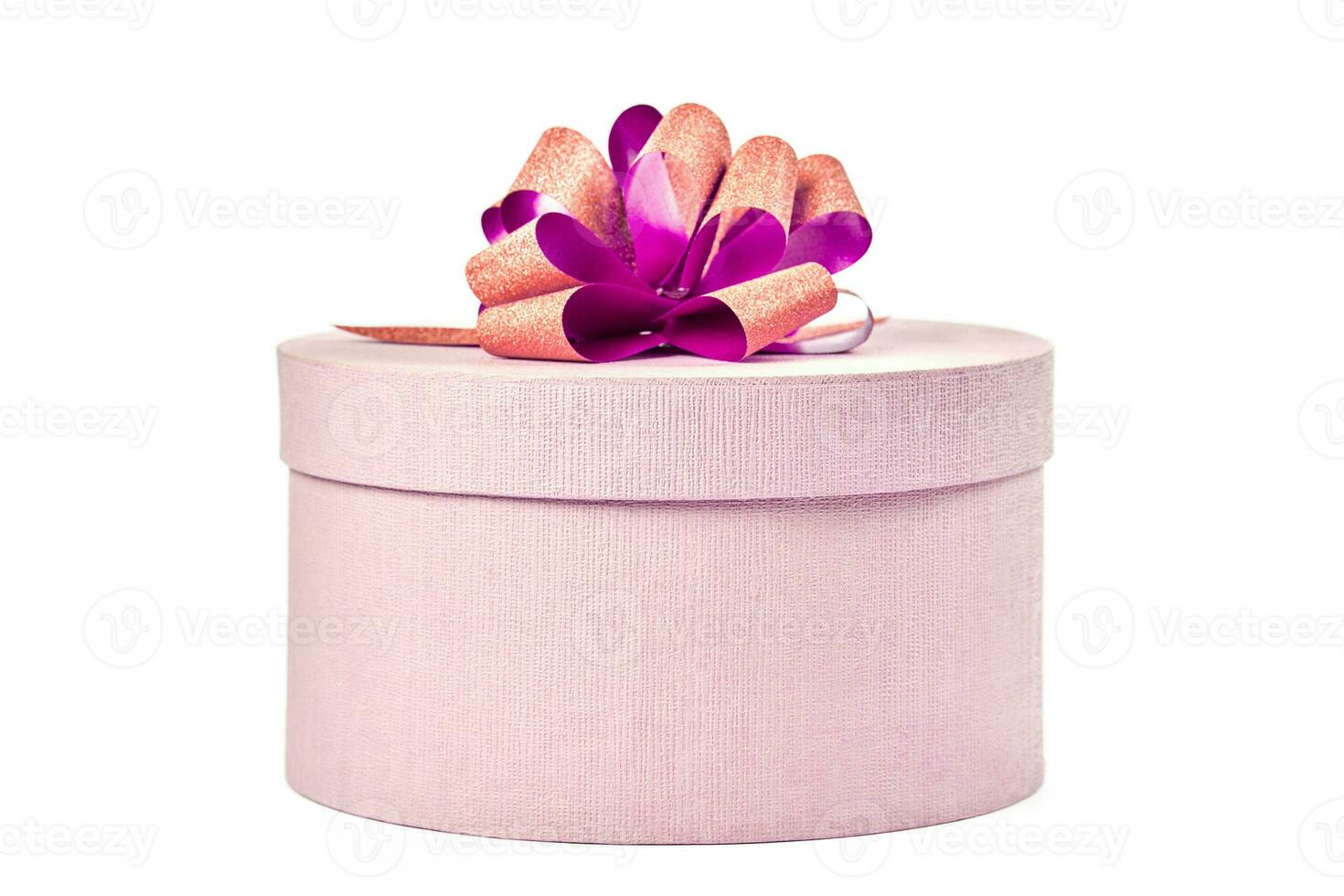 Round gift box with bow, isolated photo