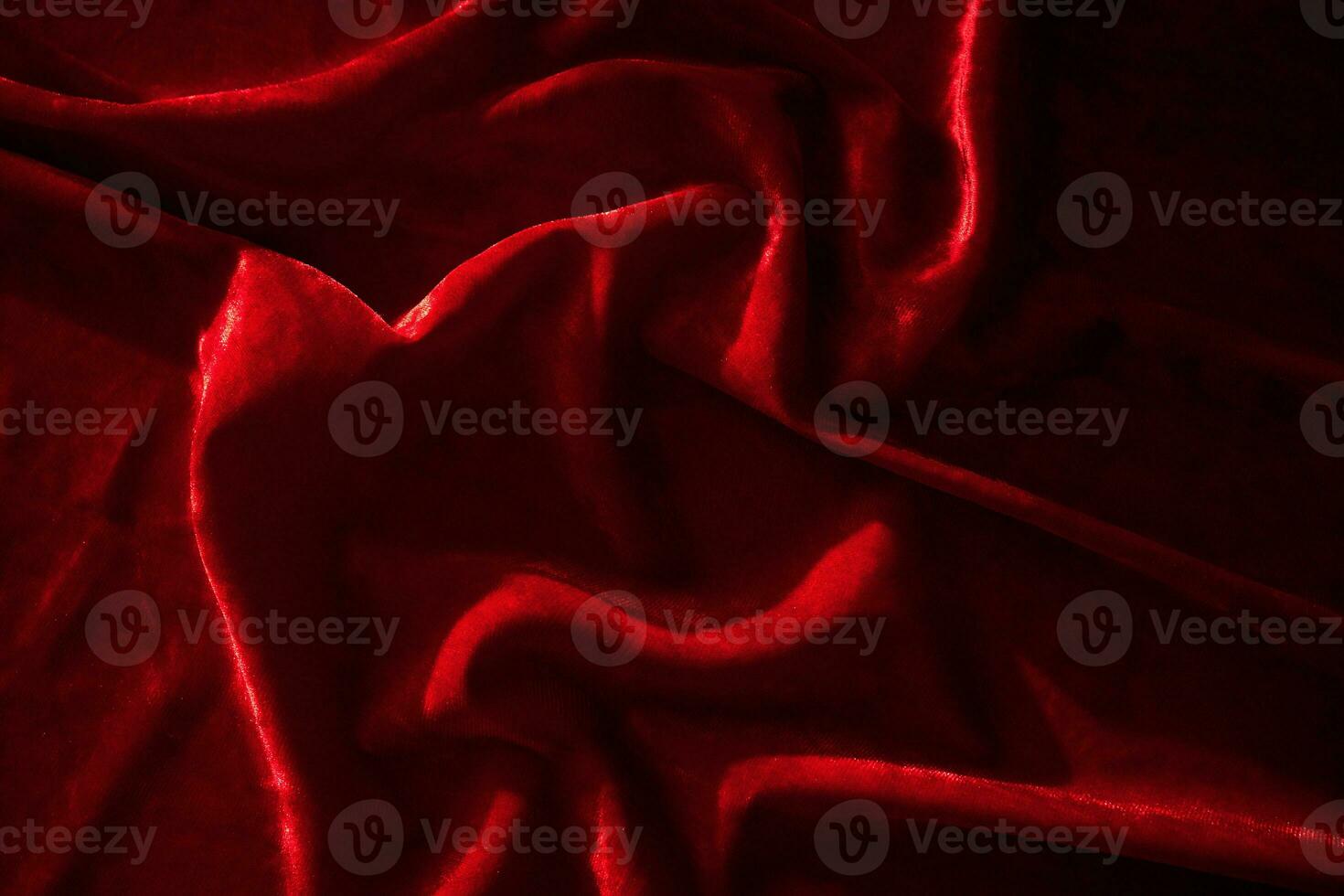 Abstract background made of red velvet fabric. photo