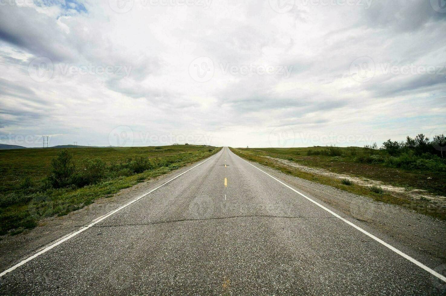 an empty road is shown in the distance photo