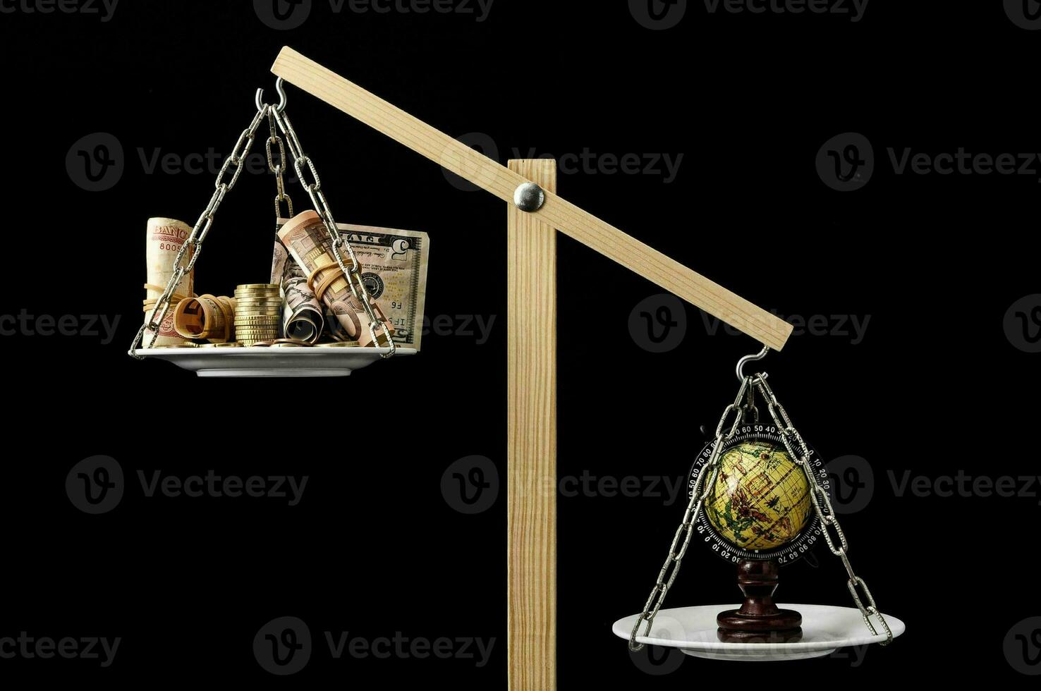 a balance scale with a globe and a globe on it photo