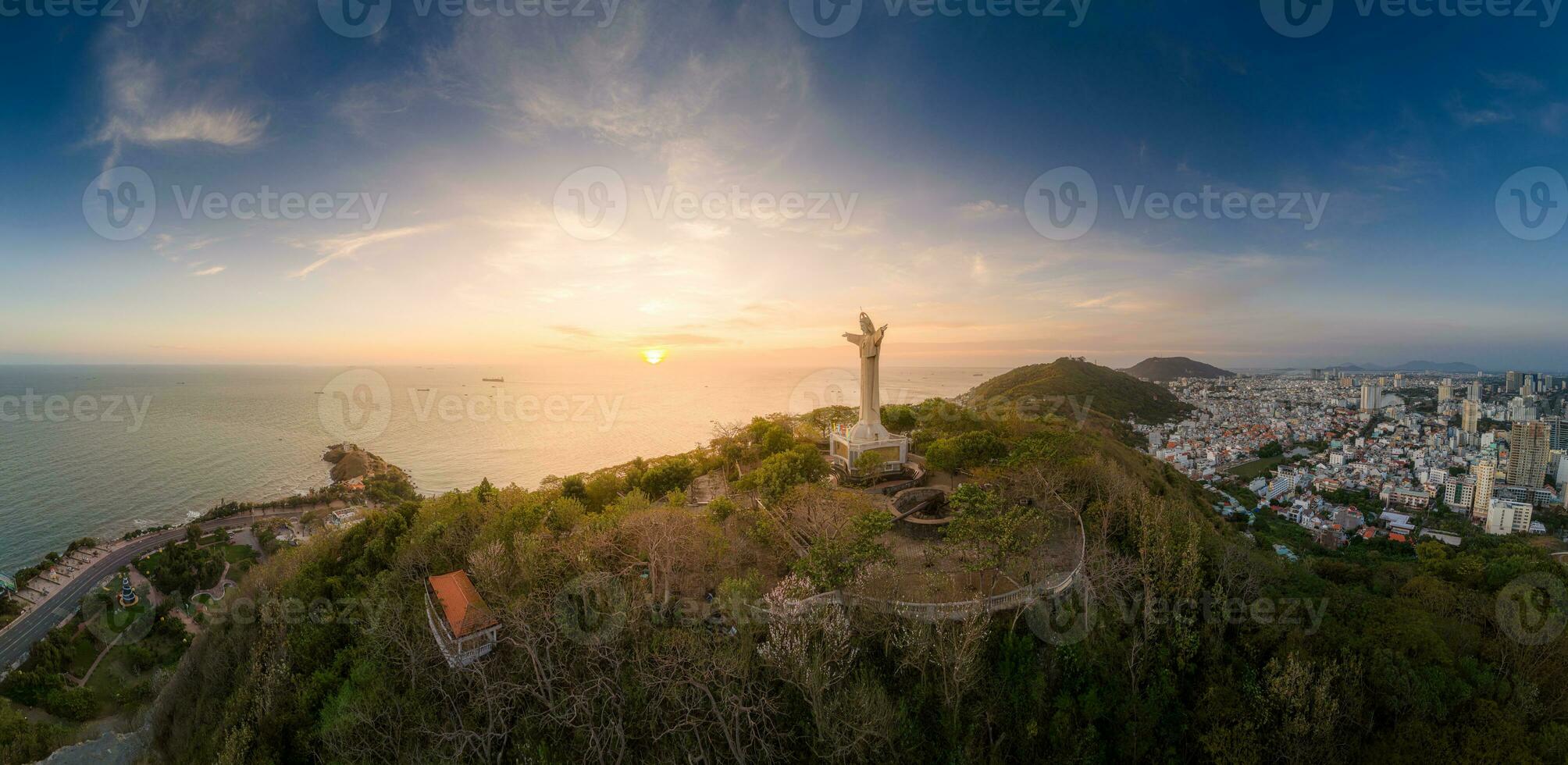 Aerial view of Vung Tau city, Vietnam, panoramic view of the peaceful and beautiful coastal city behind the statue of Christ the King standing on Mount Nho in Vung Tau city. photo