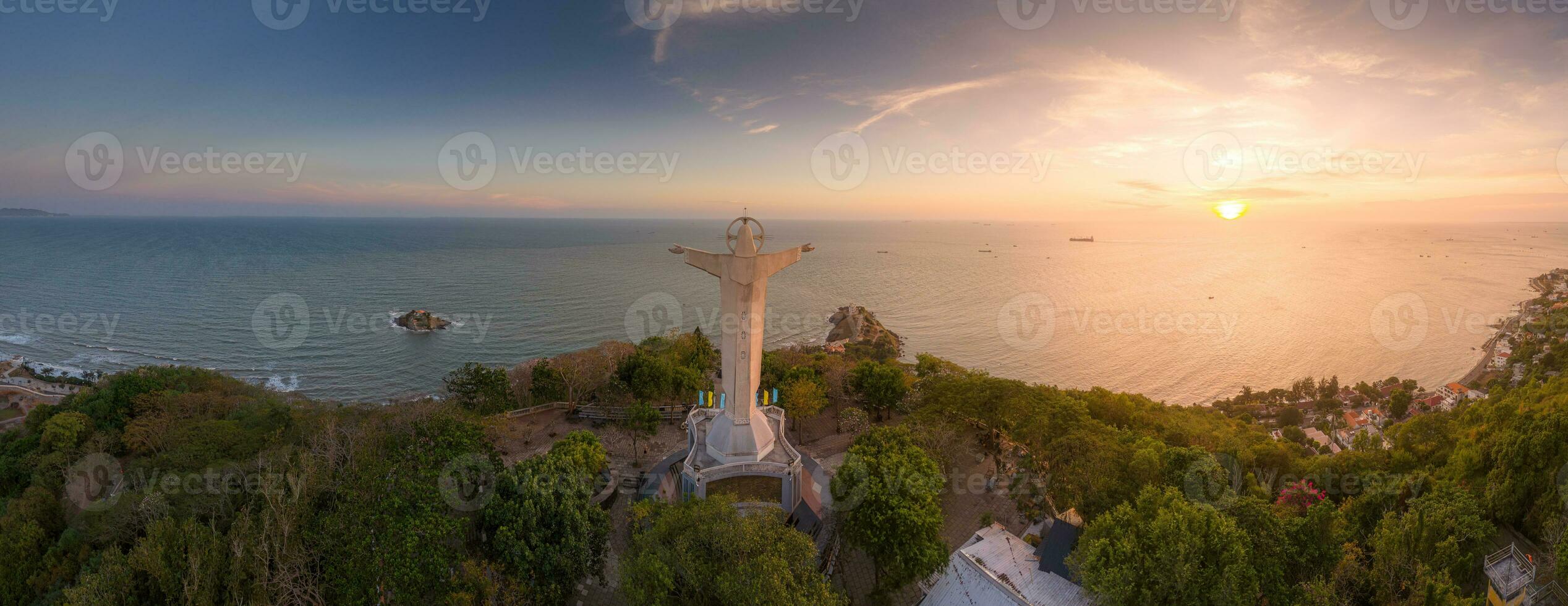 Aerial view of Vung Tau city, Vietnam, panoramic view of the peaceful and beautiful coastal city behind the statue of Christ the King standing on Mount Nho in Vung Tau city. photo