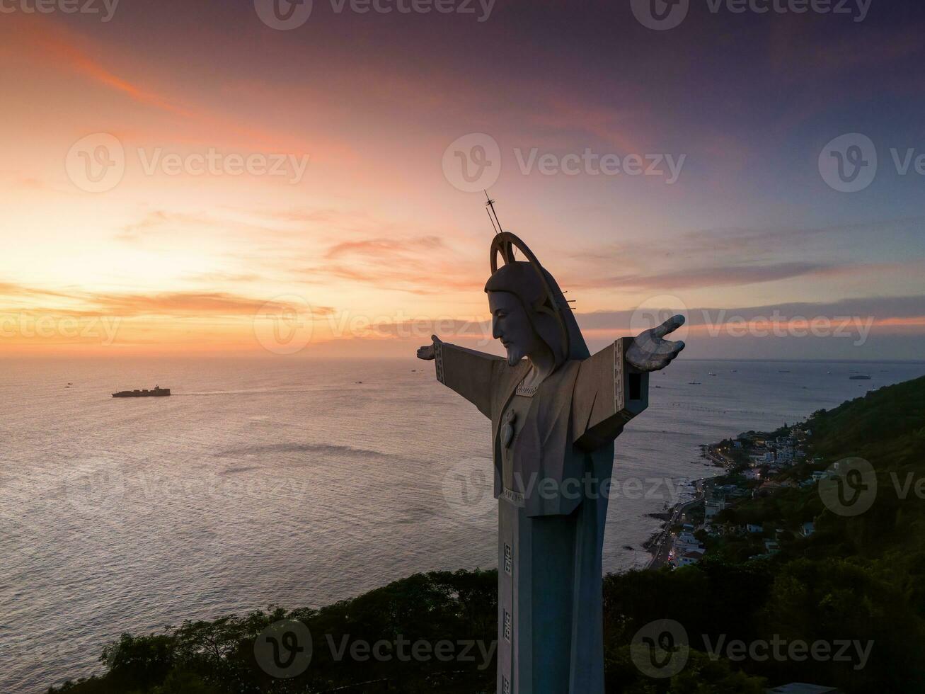 Aerial view of Vung Tau city, Vietnam, panoramic view of the peaceful and beautiful coastal city behind the statue of Christ the King standing on Mount Nho in Vung Tau city. photo