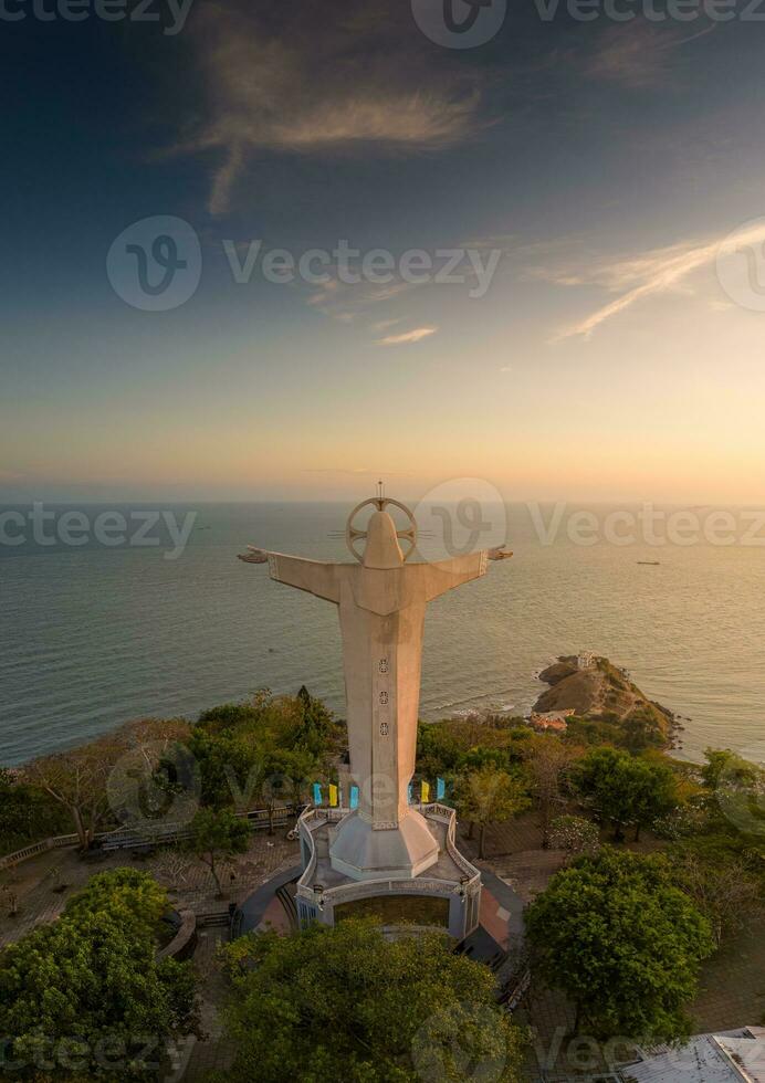 Aerial view of Vung Tau city, Vietnam, panoramic view of the peaceful and beautiful coastal city behind the statue of Christ the King standing on Mount Nho in Vung Tau city. photo