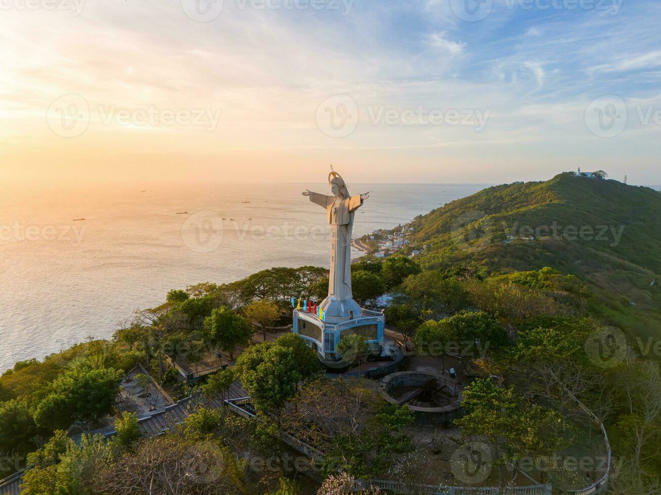 Aerial view of Vung Tau city, Vietnam, panoramic view of the peaceful and beautiful coastal city behind the statue of Christ the King standing on Mount Nho in Vung Tau city. photo