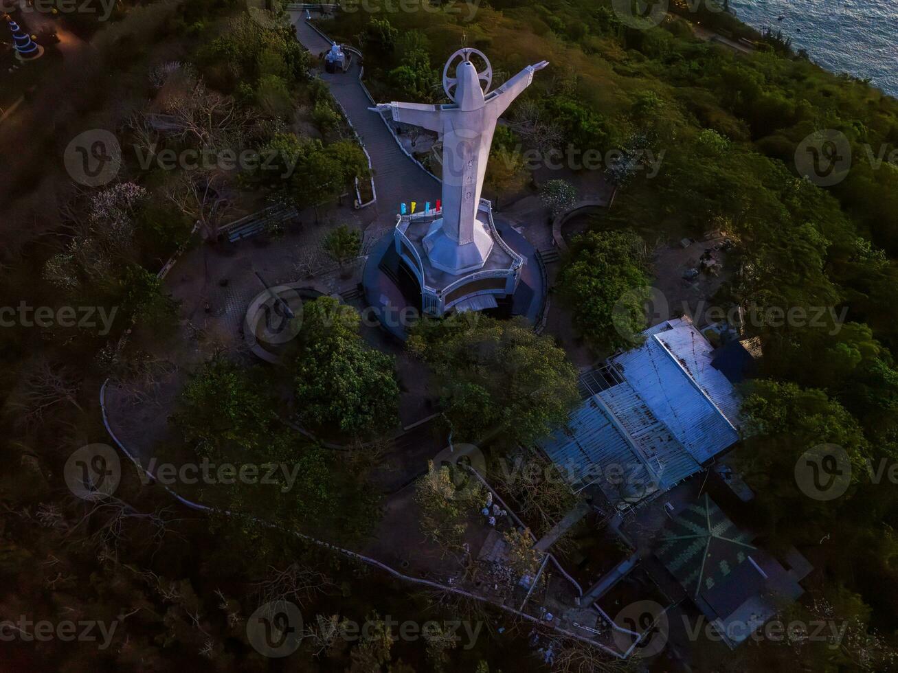 Aerial view of Vung Tau city, Vietnam, panoramic view of the peaceful and beautiful coastal city behind the statue of Christ the King standing on Mount Nho in Vung Tau city. photo