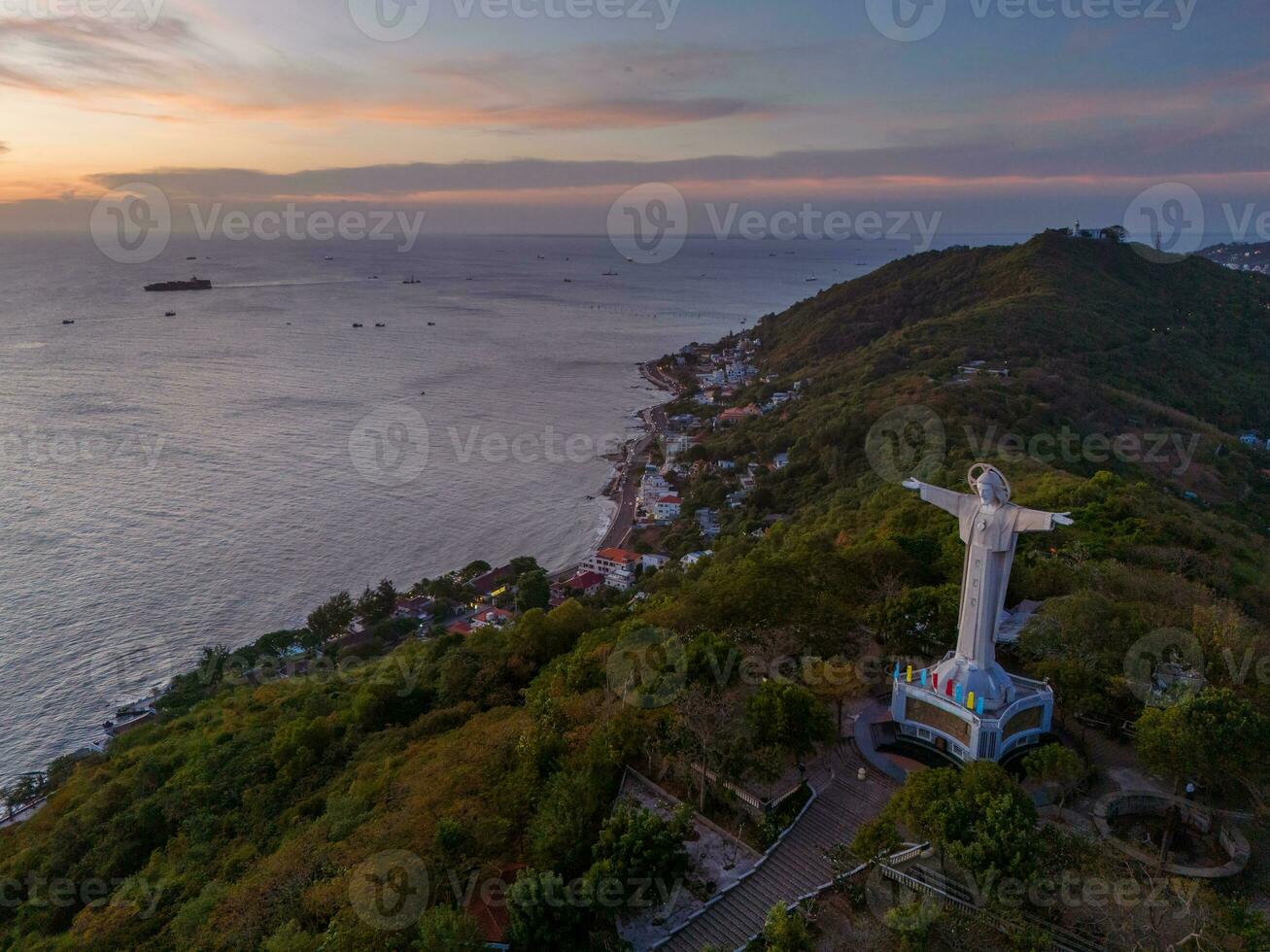 Aerial view of Vung Tau city, Vietnam, panoramic view of the peaceful and beautiful coastal city behind the statue of Christ the King standing on Mount Nho in Vung Tau city. photo