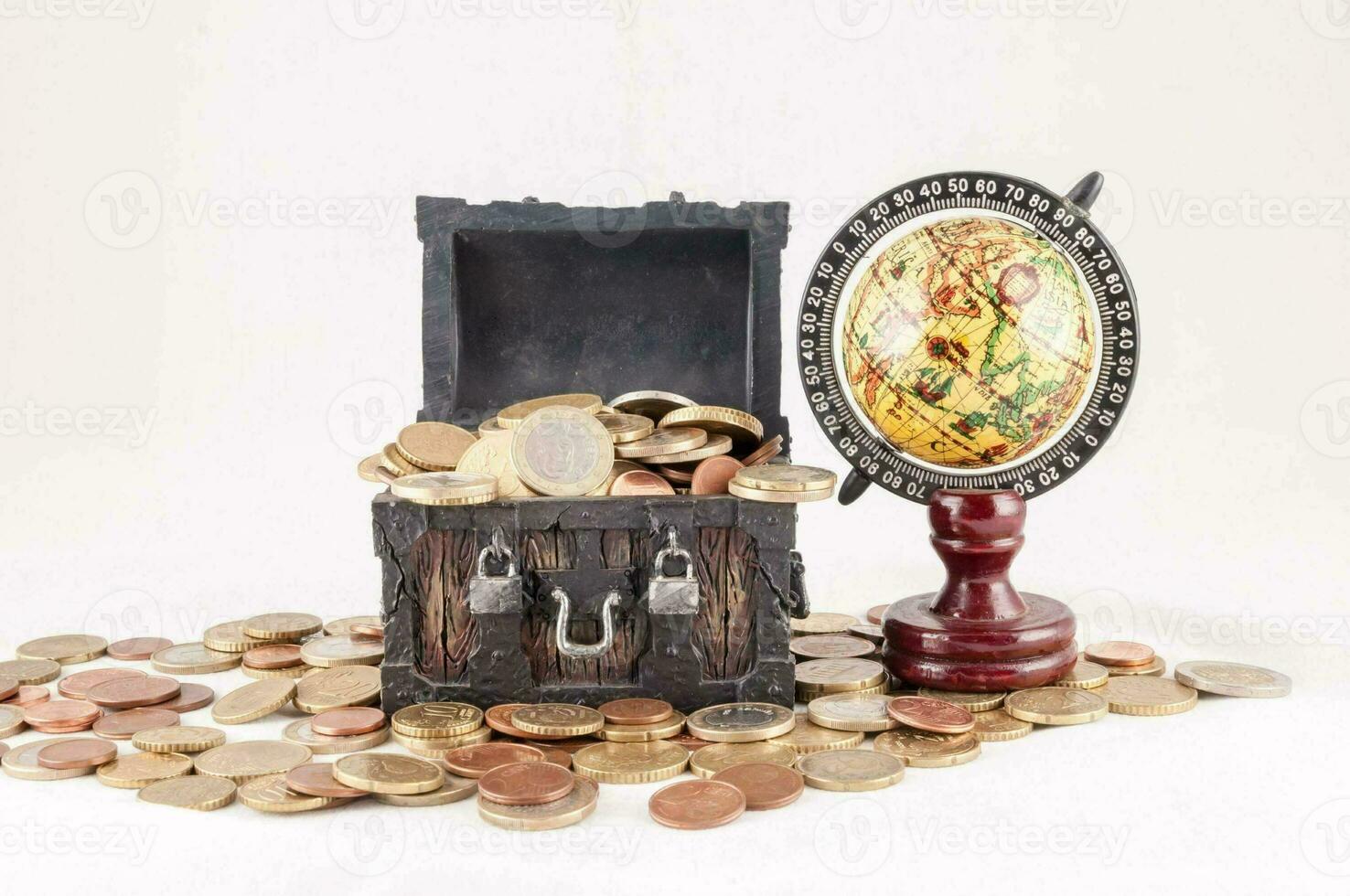 a chest with coins and a globe photo