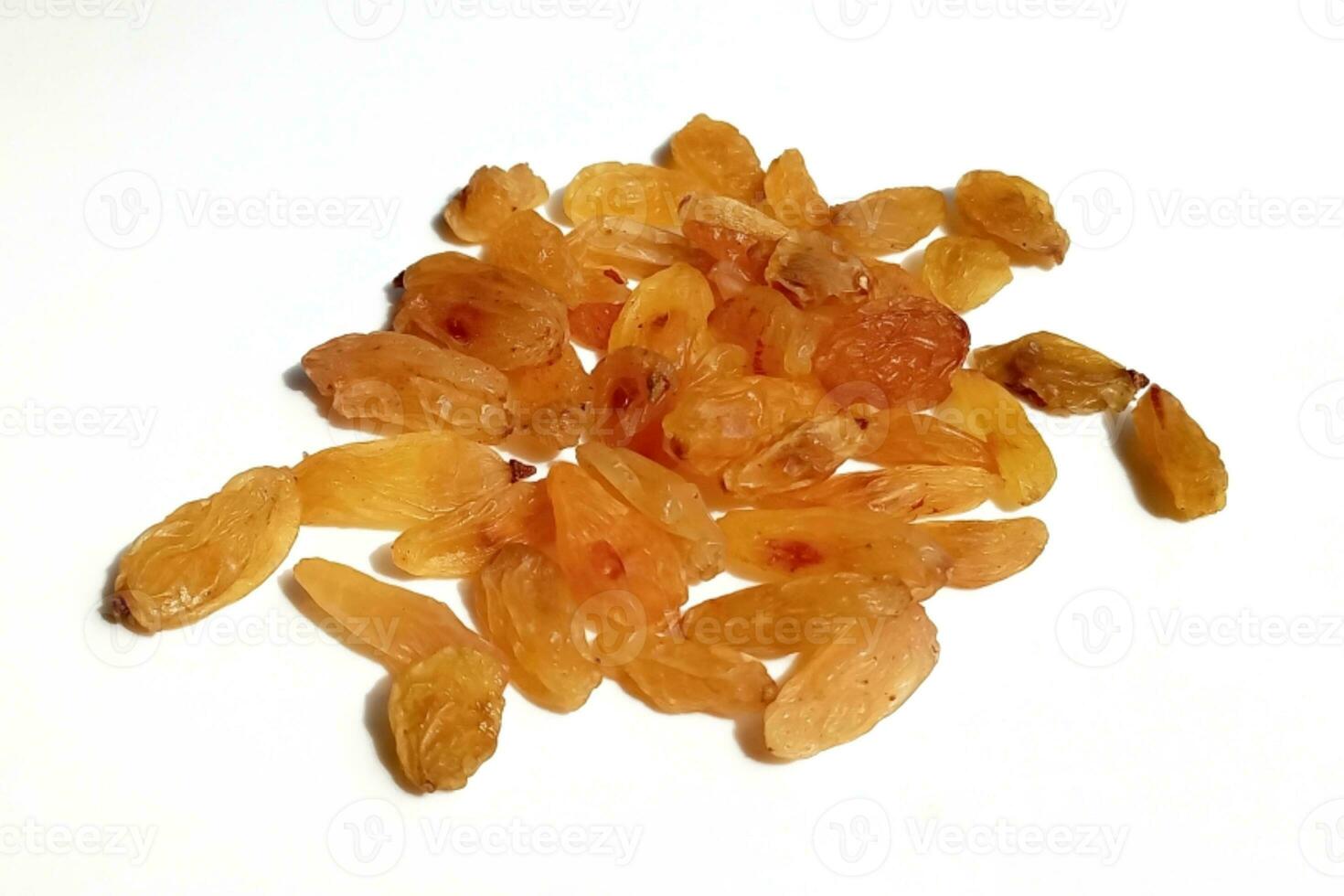 Yellow raisins isolated on white background photo