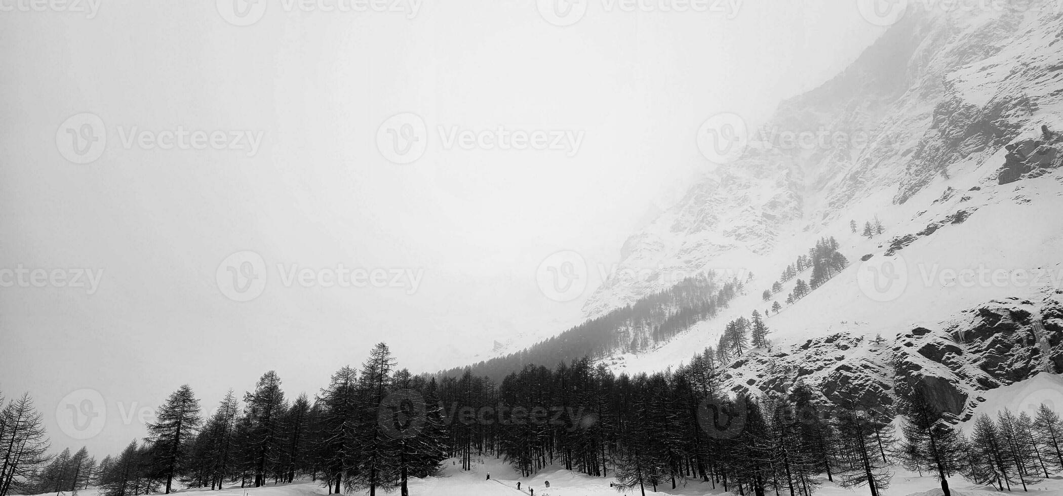 winter landscapes of the Aosta valley, the Alps mountain range in December 2023 at the beginning of the cold winter photo