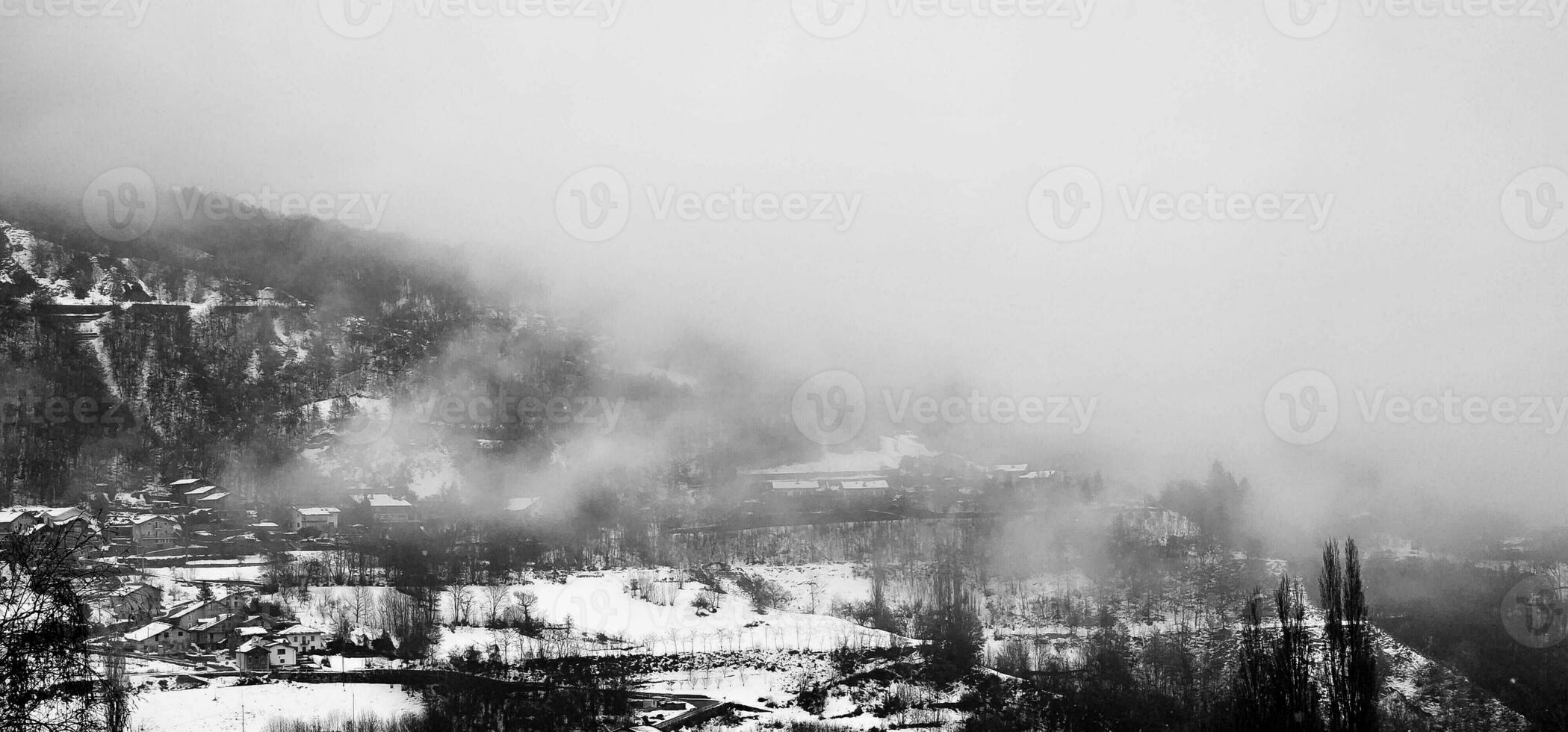 winter landscapes of the Aosta valley, the Alps mountain range in December 2023 at the beginning of the cold winter photo