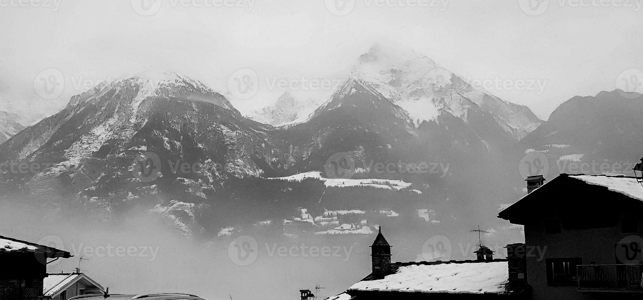 winter landscapes of the Aosta valley, the Alps mountain range in December 2023 at the beginning of the cold winter photo