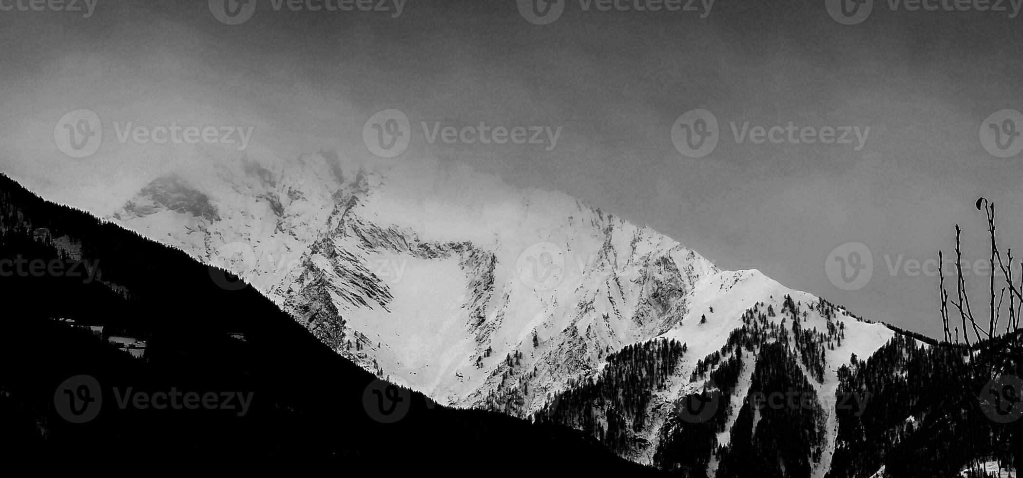 winter landscapes of the Aosta valley, the Alps mountain range in December 2023 at the beginning of the cold winter photo