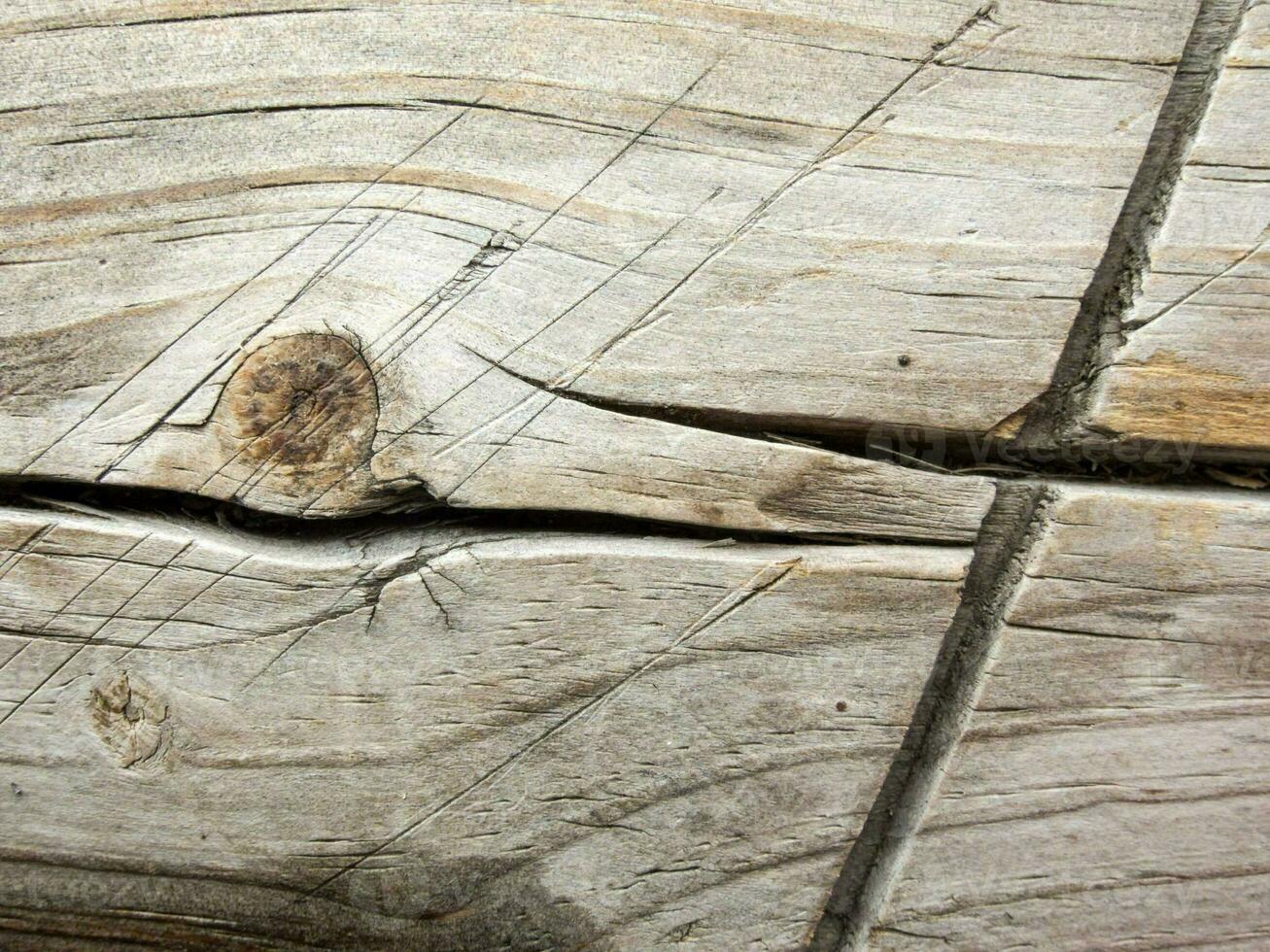 close up of a wooden plank with a hole in it photo