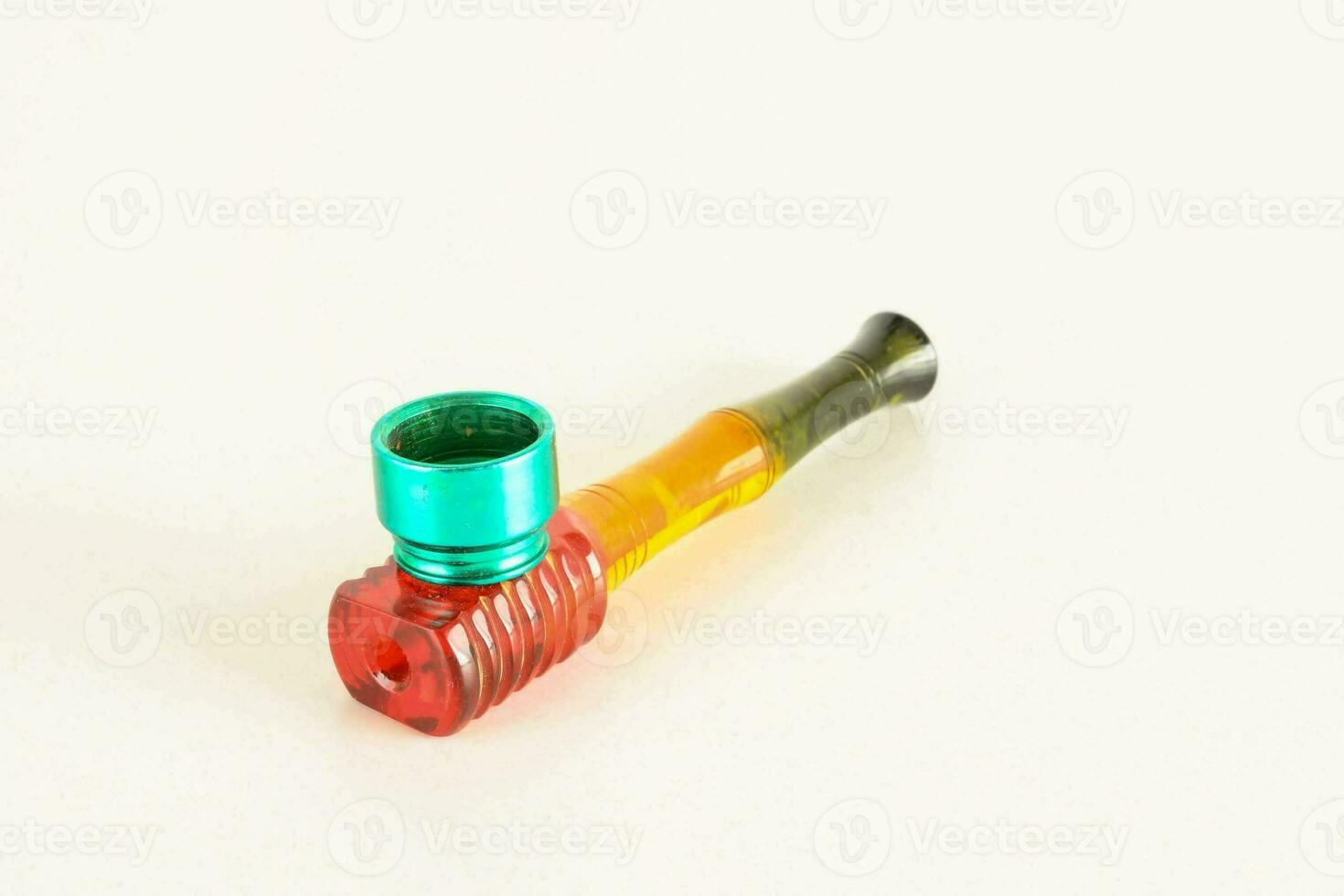 a glass pipe with a red and green tip photo