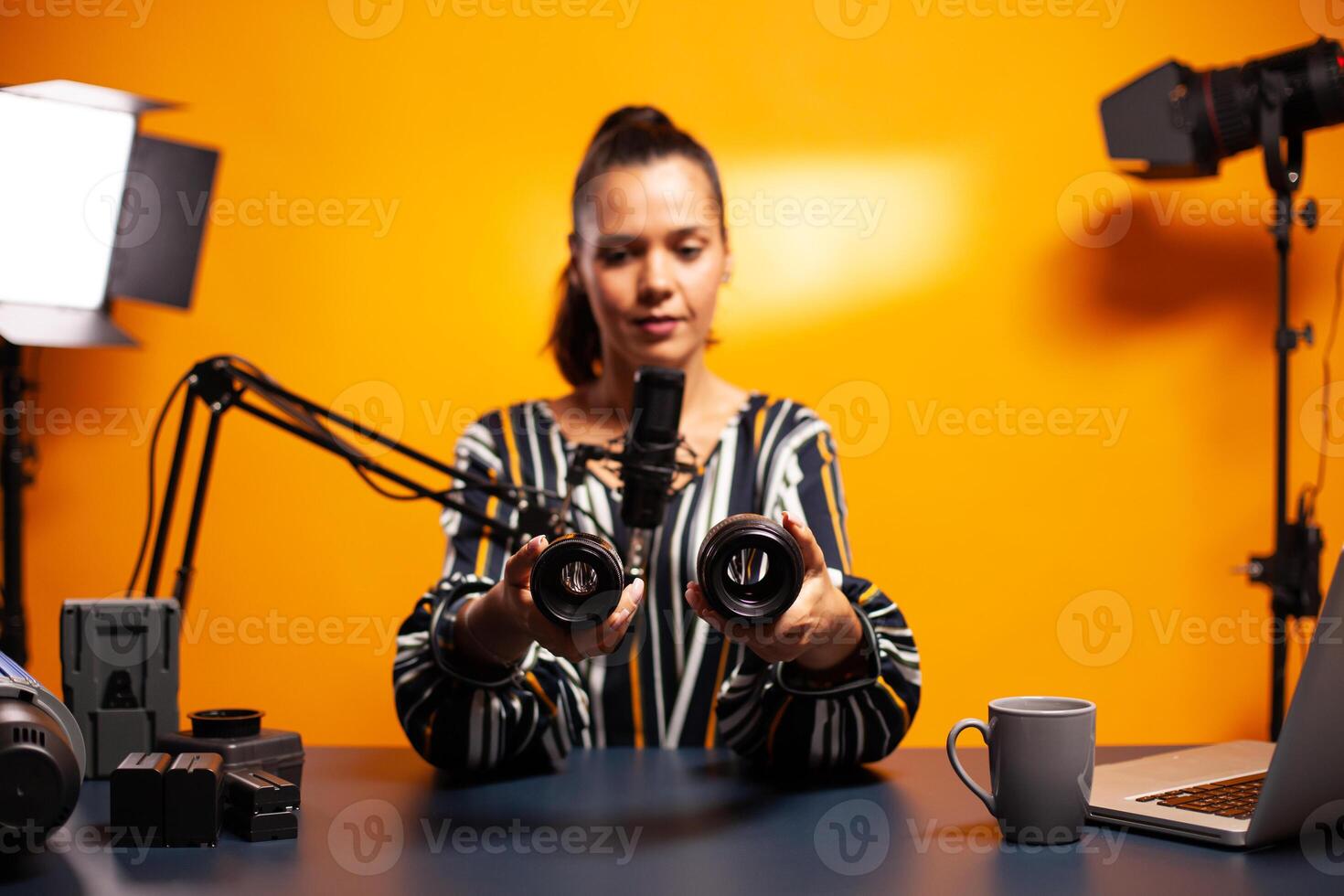 Photography vloger recording video while testing new lens for his camera. New media star influencer on social media talking video photo equipment for online internet web show.