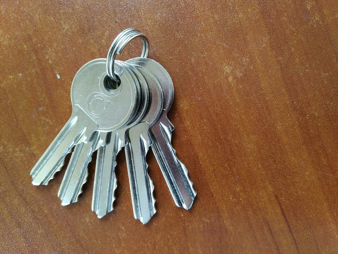 AI generated Bunch of keys on wooden background, closeup of photo