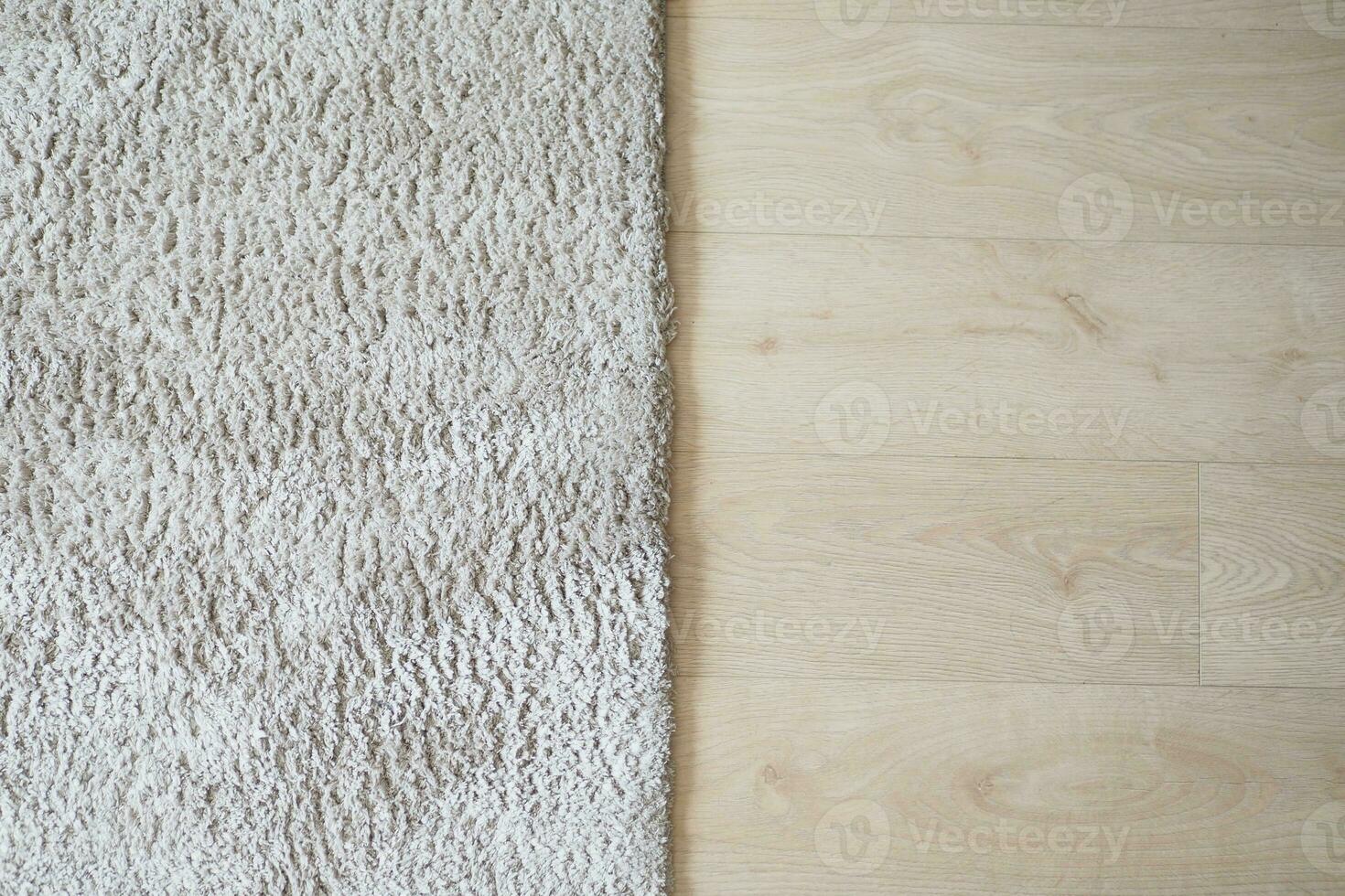 Seamless carpet texture background on wooden floor with copy space photo