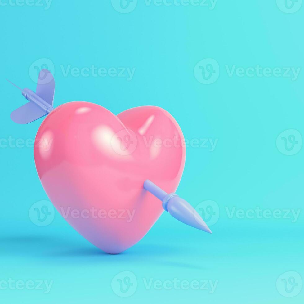 Pink heart pierced by cupid arrow on bright blue background in pastel colors photo