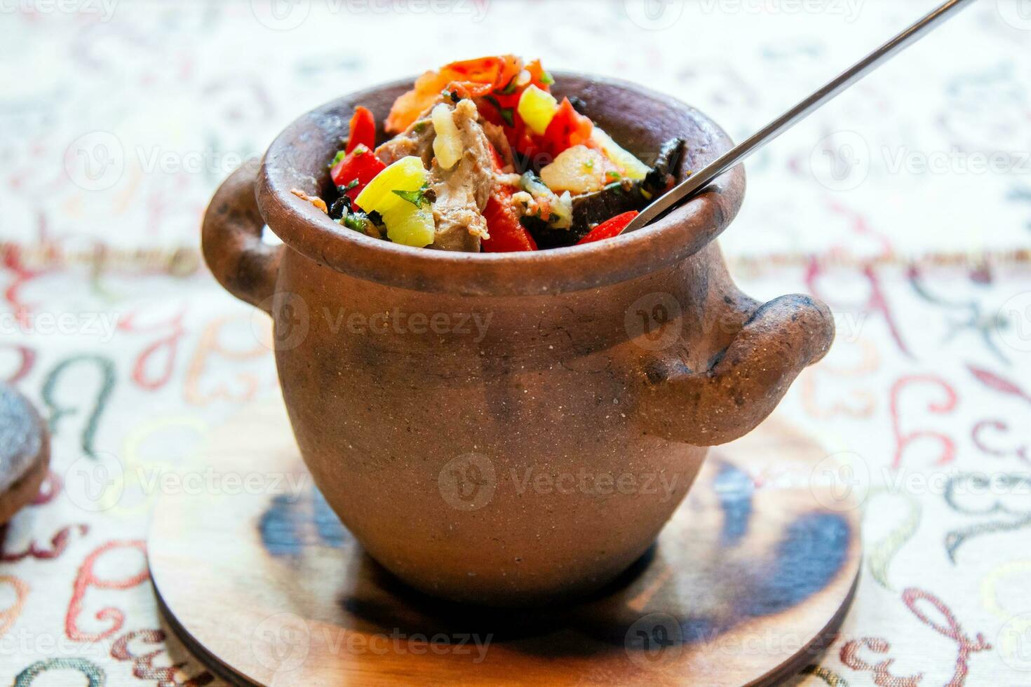 eating of Chanakhi in pot close up in local cafe photo