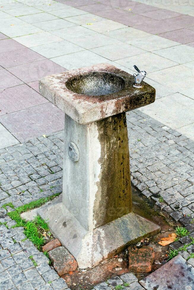 old water bubbler on street of Tbilisi city photo