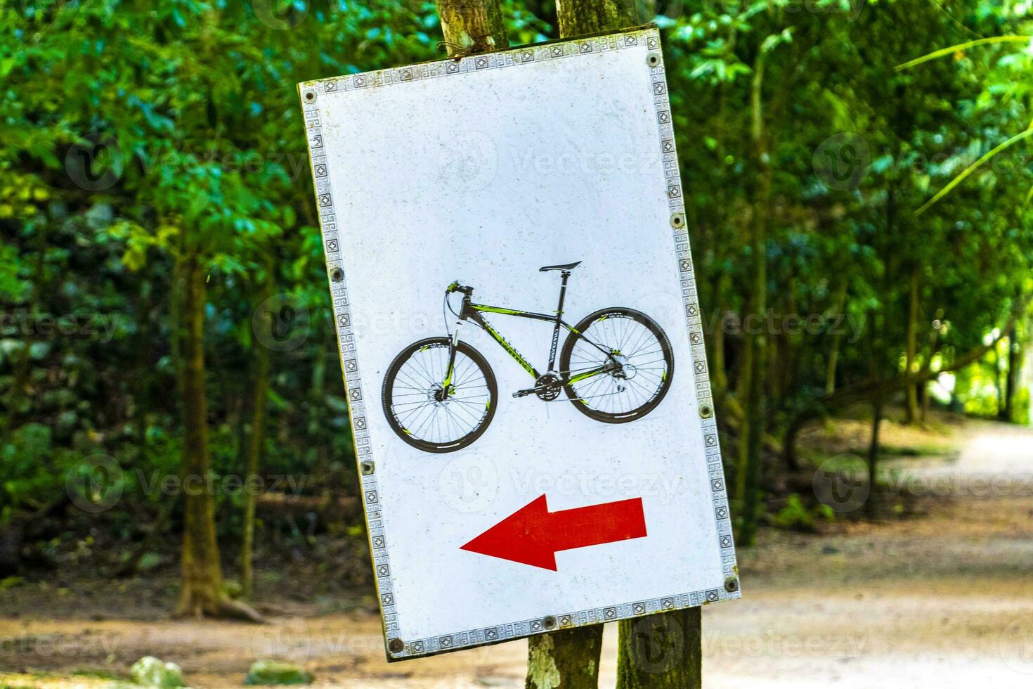 Rent a bike sign arrow information board direction in Coba Ruins. photo