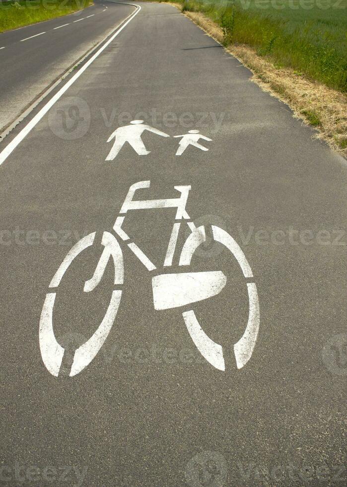 Footpath and bicycle lane sign on the sidewalk photo