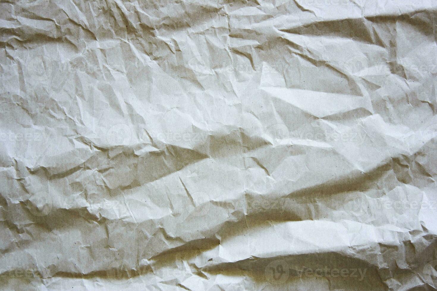 Texture of crumpled paper. Light textured background. photo