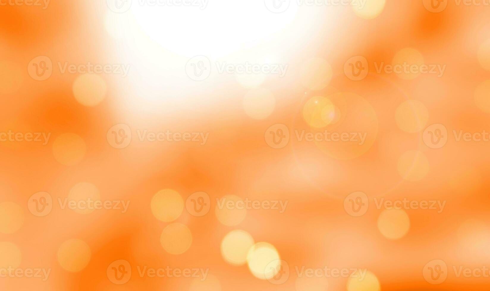 Abstract summer background. Orange background with defocused light. photo