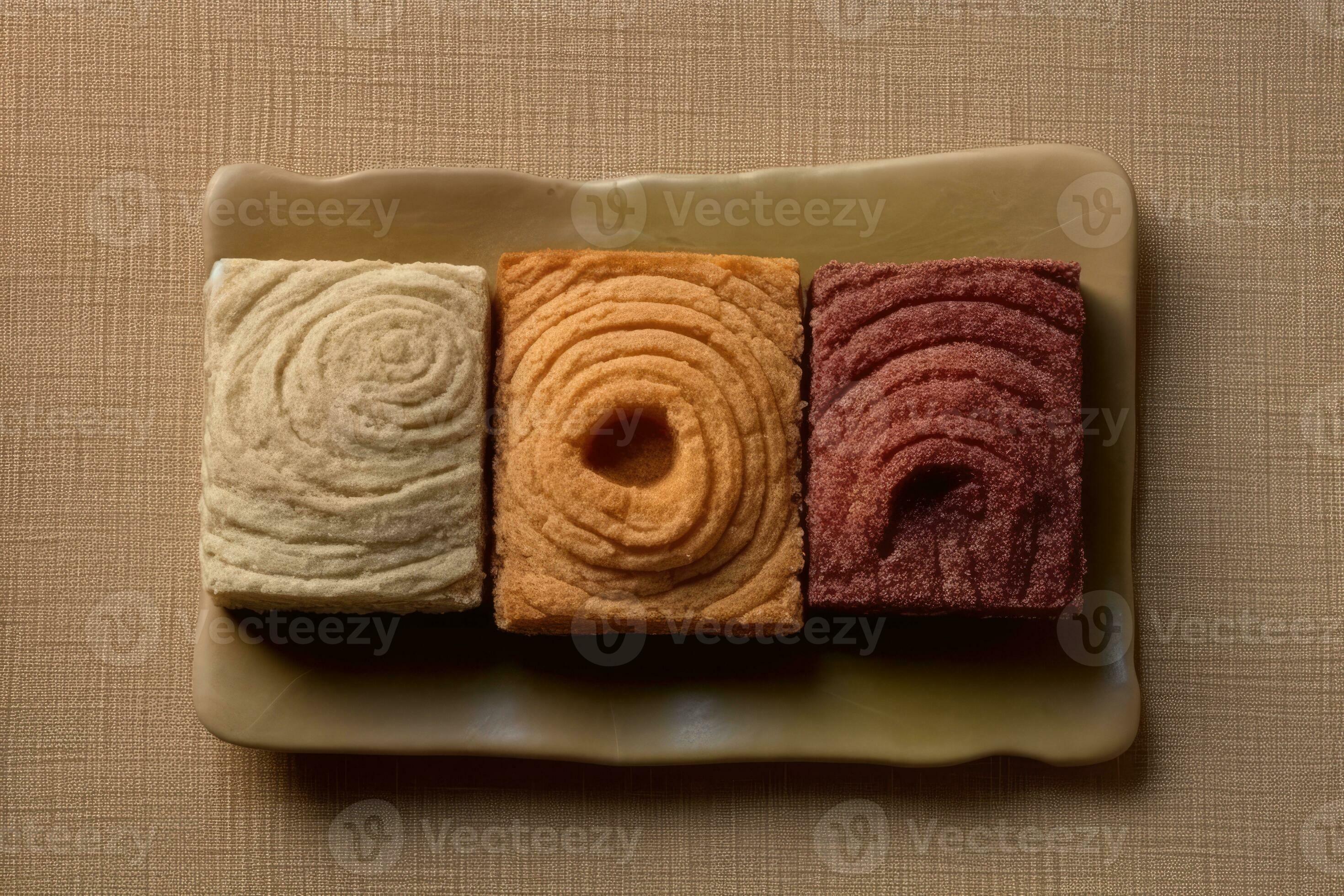 ai-generated-four-different-color-cakes-on-a-plate-35688330-stock-photo