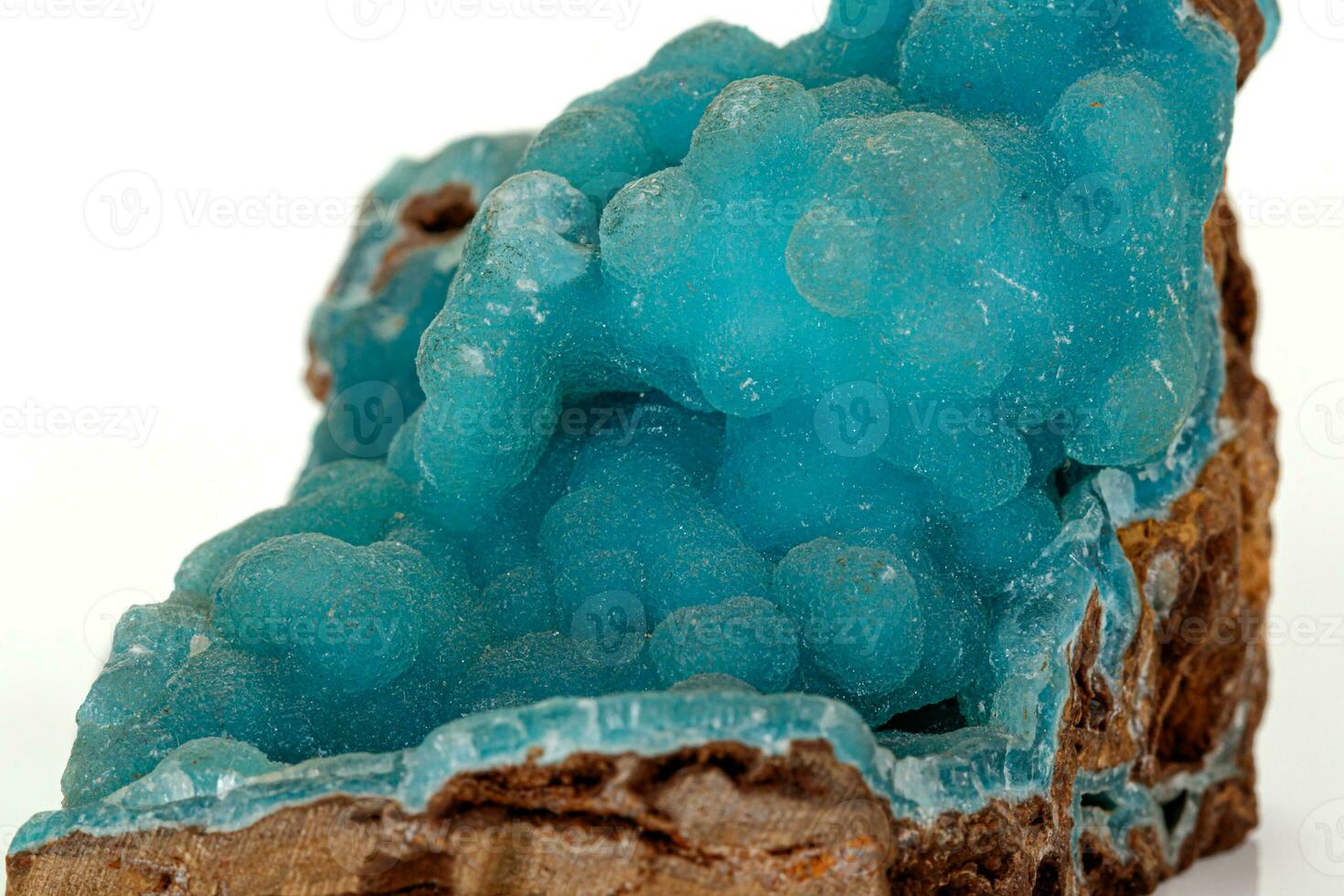 Macro pink Smithsonite mineral stone on microcline on white background photo