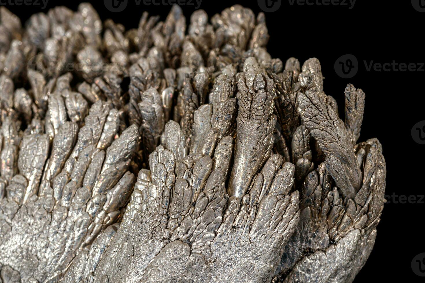 Macro of a stone Stibnite mineral on a black background photo