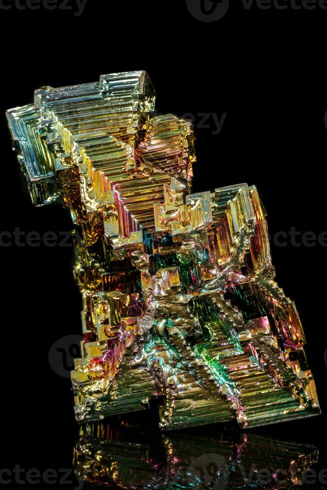 Macro of the stone bismuth mineral on a black background photo