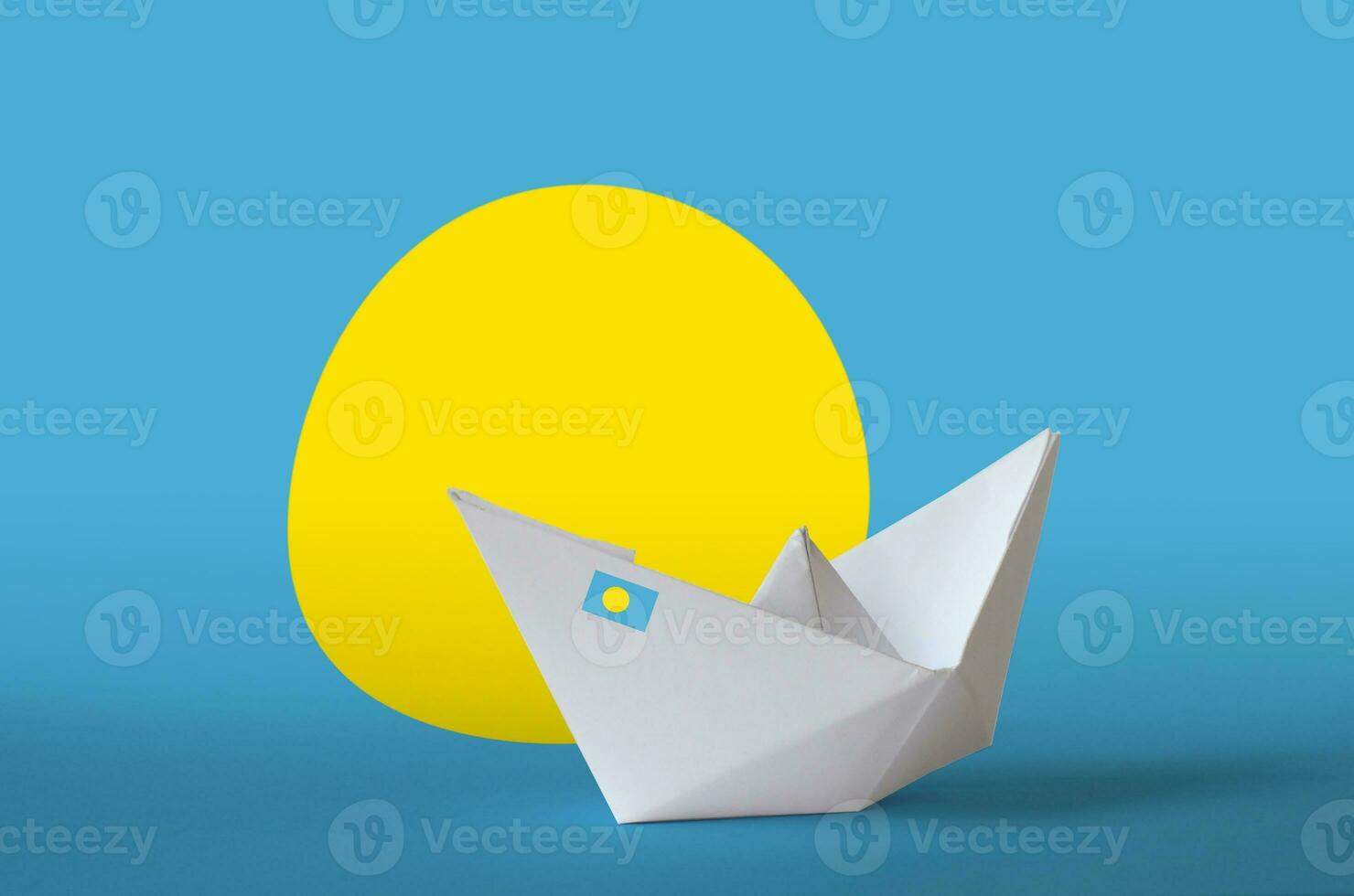 Palau flag depicted on paper origami ship closeup. Handmade arts concept photo