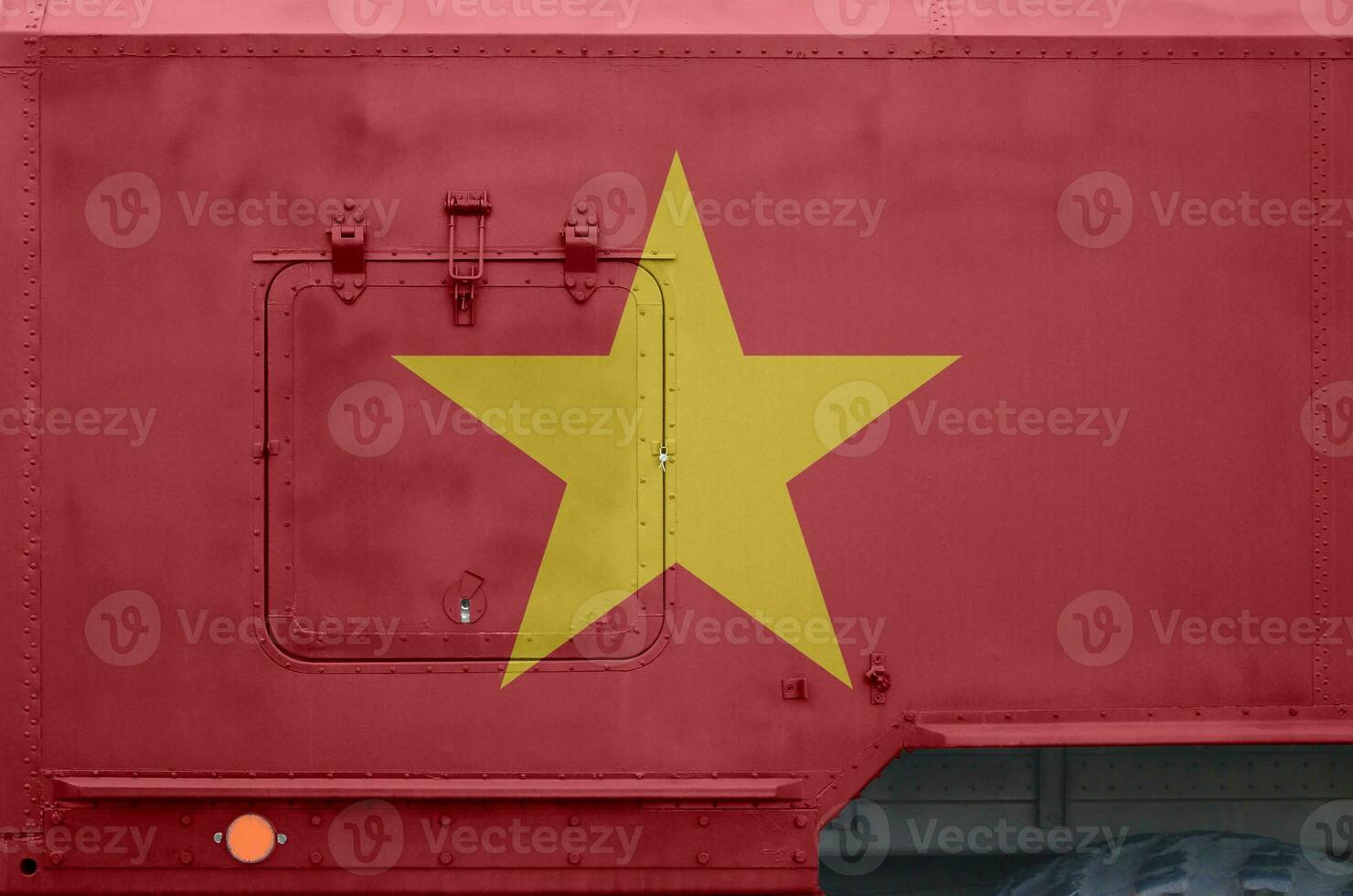 Vietnam flag depicted on side part of military armored truck closeup. Army forces conceptual background photo