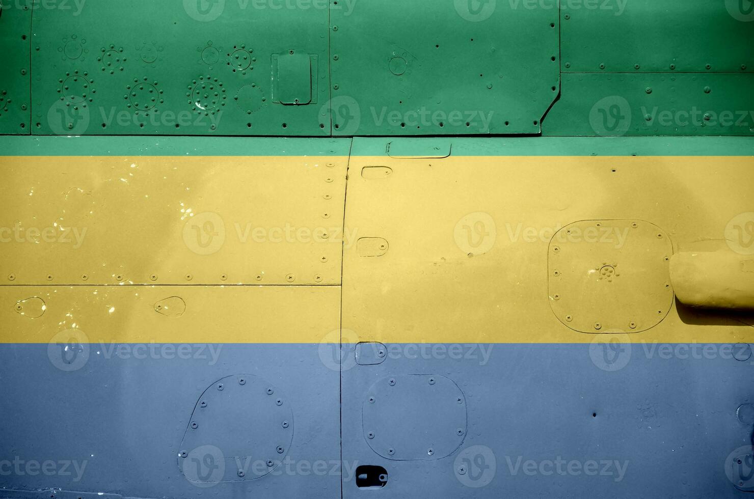 Gabon flag depicted on side part of military armored helicopter closeup. Army forces aircraft conceptual background photo