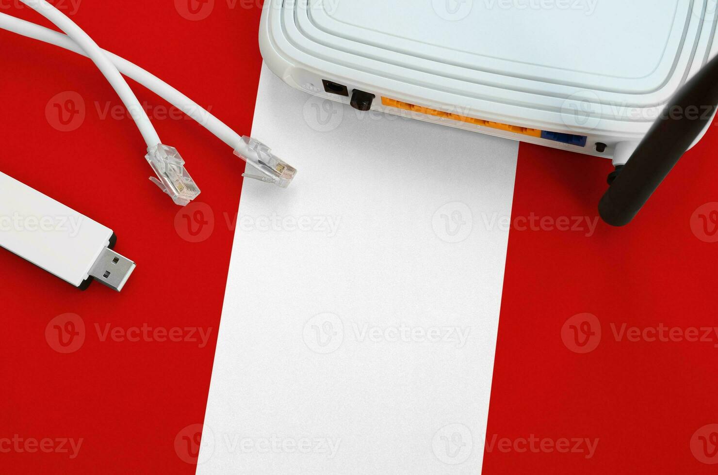 Peru flag depicted on table with internet rj45 cable, wireless usb wifi adapter and router. Internet connection concept photo