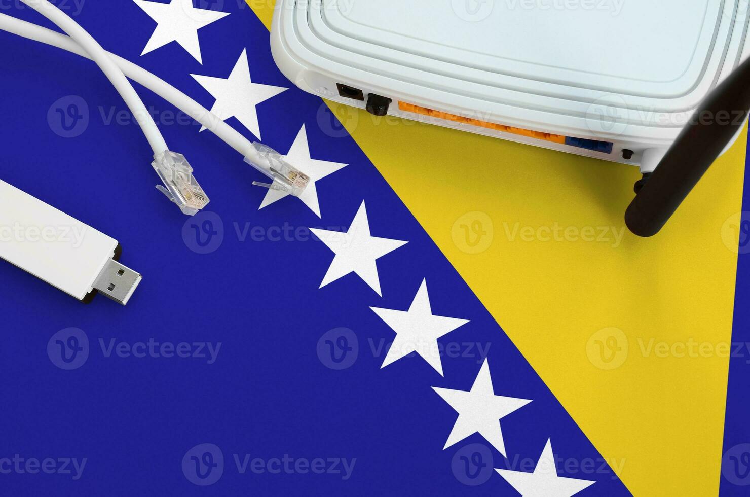 Bosnia and Herzegovina flag depicted on table with internet rj45 cable, wireless usb wifi adapter and router. Internet connection concept photo