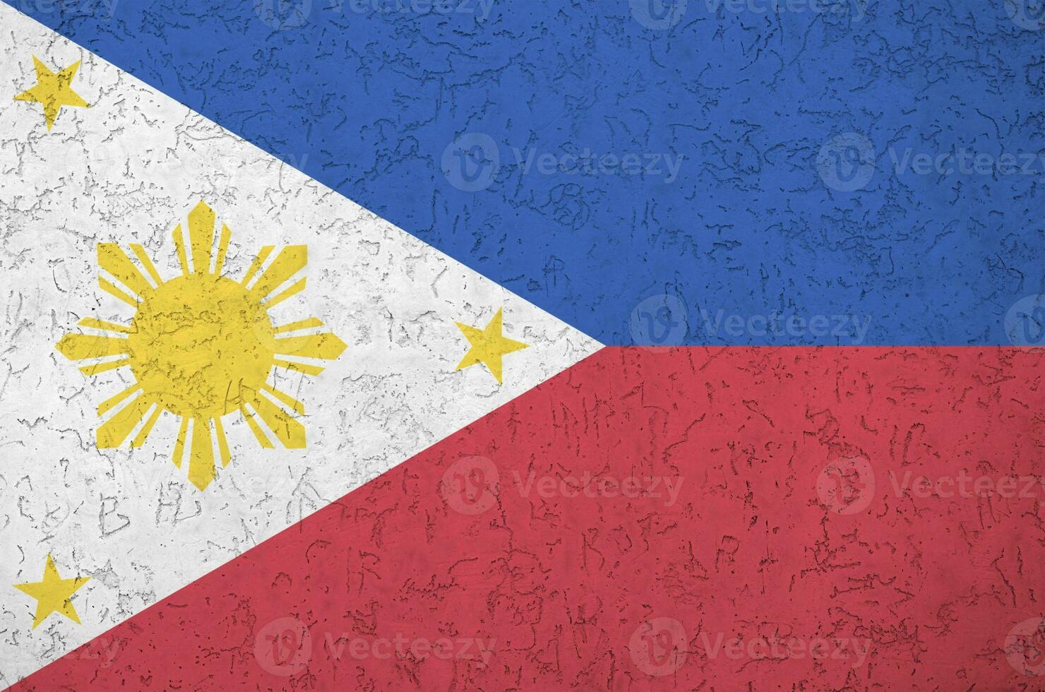 Philippines flag depicted in bright paint colors on old relief plastering wall. Textured banner on rough background photo