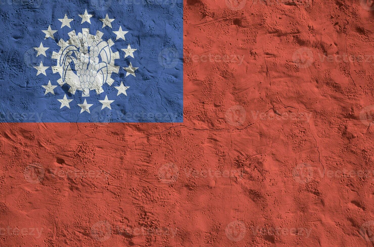 Myanmar flag depicted in bright paint colors on old relief plastering wall. Textured banner on rough background photo