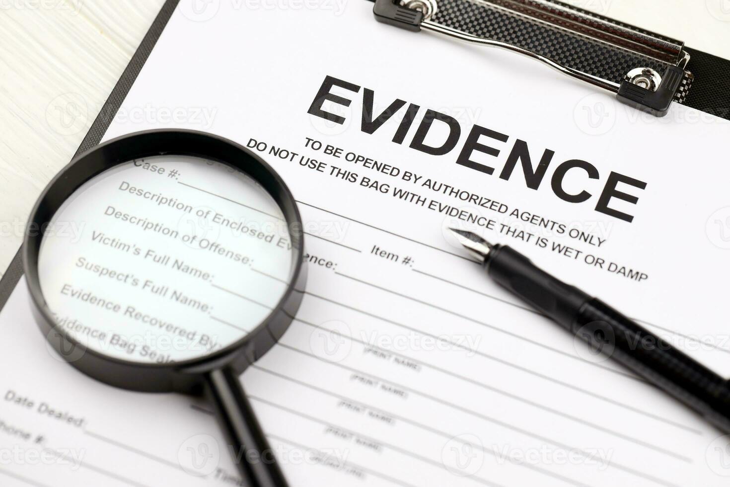 Evidence report blank on A4 tablet lies on office table with pen and magnifying glass photo