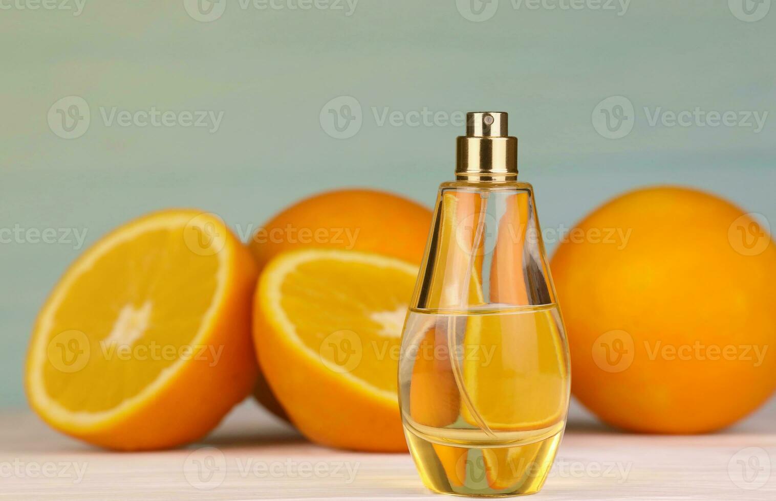 Perfume with citrus extracts. Selective focus. Spa day, concept of freshness perfume bottle with lemon lime and orange photo