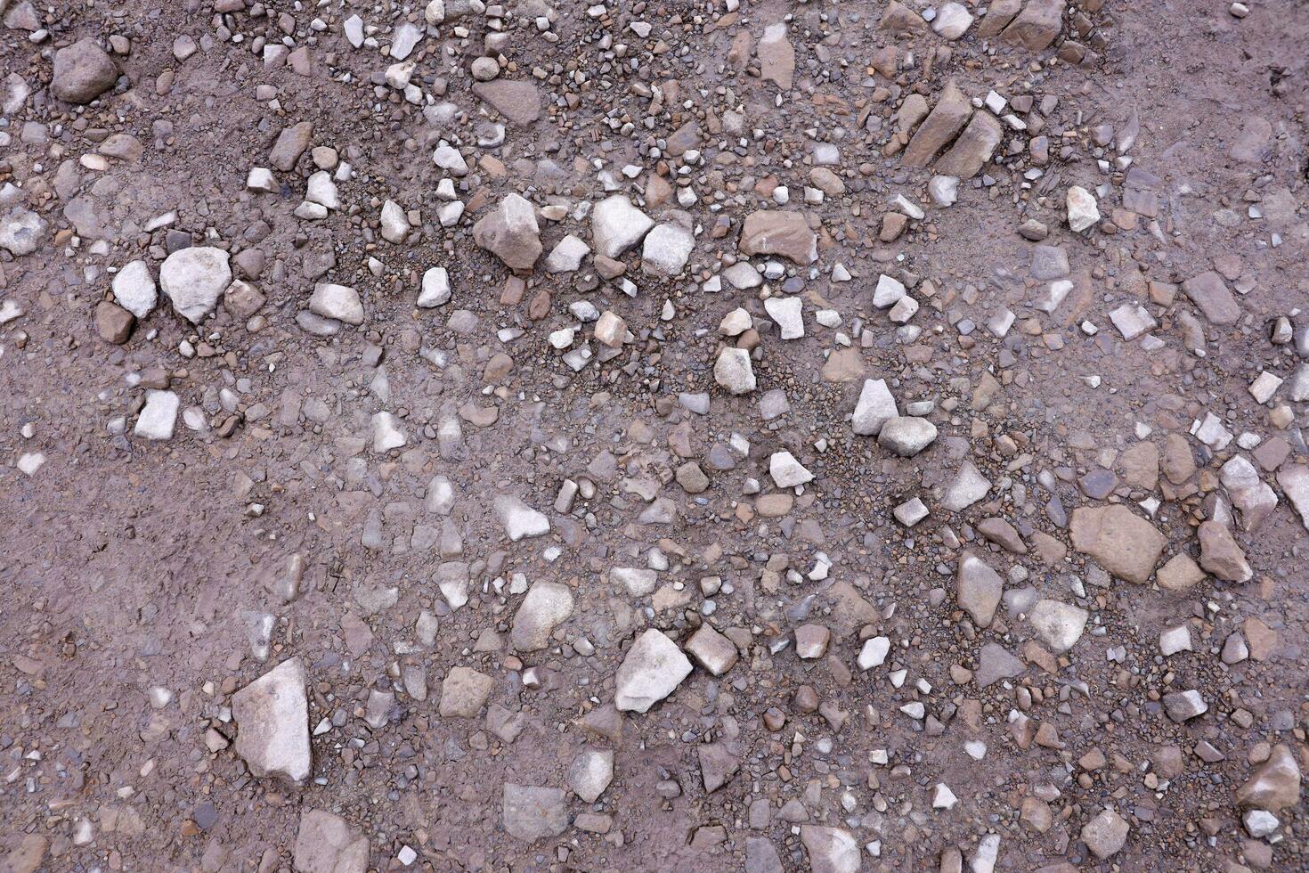 Background of shattered stony stones surface in mountain area. Texture with natural light photo